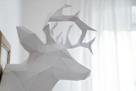 origami papercraft model of white stag head vault sculptureの写真素材