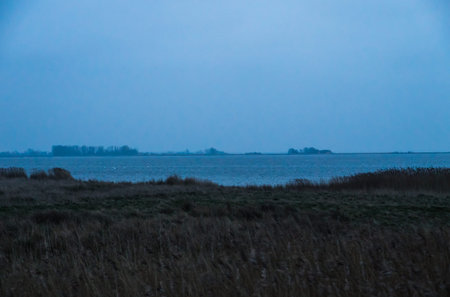 Misty Groyne landscape at foggy turquoise cyan seaの写真素材