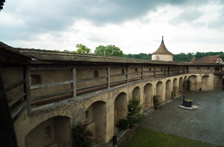 Antiquity beautiful big romantic tunnel in century strong defensive bulwark and inner courtyardの写真素材