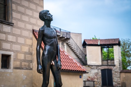 PRAGUE, CZECH statue of a young naked nude man close to Prague Castle Eastern gateの写真素材
