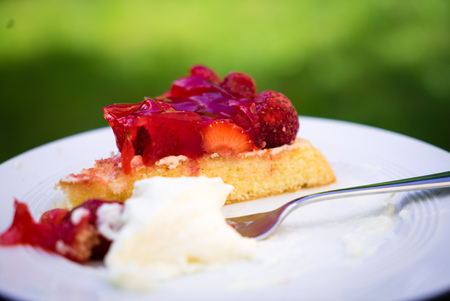 Deliciously sweet strawberry pie with whipped cream.の写真素材