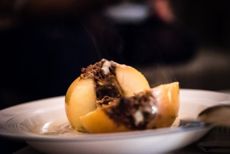delicious baked apple in winter on white plate