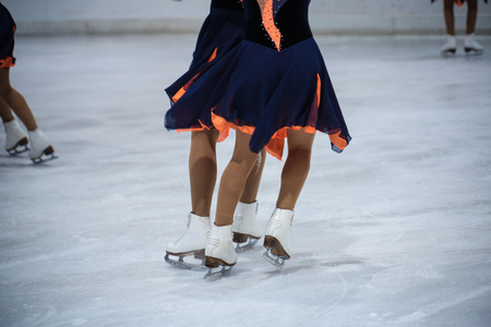 Young women ice skating on a freezing winter day color toned image motion blurred imageの写真素材