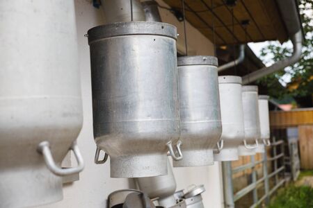 milk buckets outside German farm for cowsの写真素材