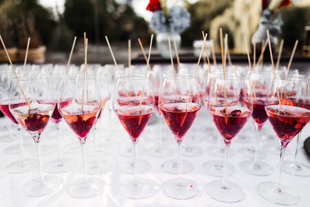 red cocktails in glasses on summer dayの写真素材