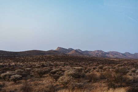 panorama photo of landscape with mountains in background in Namibiaの写真素材