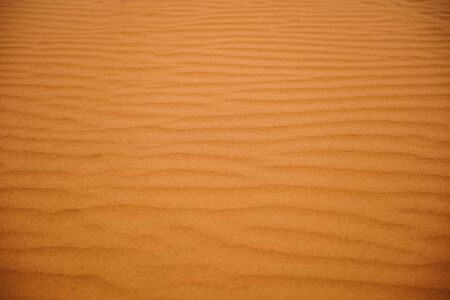 texture of red sand with structures and small stonesの写真素材