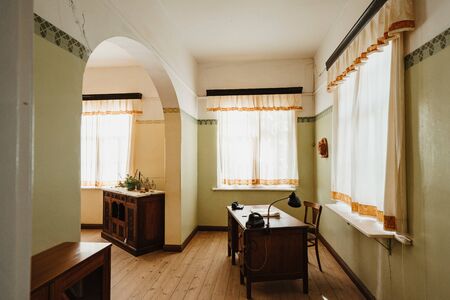 Interior of a colonial living room with table and furnituresの写真素材