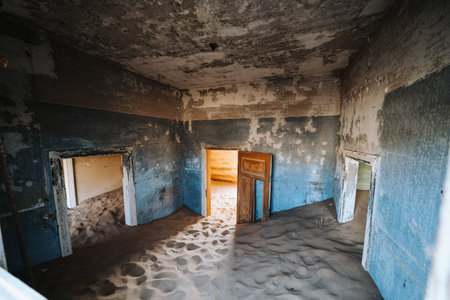 Sand Dune filling up abandoned Ghost Town House through doors and broken windowの写真素材