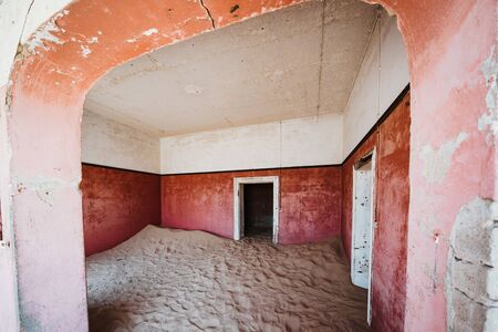 pink pastel concept room in old abandoned builing in the desert entered by sandの写真素材