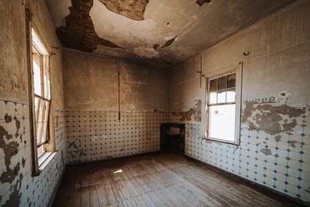 old ruined abandoned kitchen room without funiture and equipment before renovation - kitchen restoration conceptの写真素材