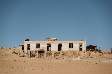 home ruins in the African desert sunk in sandの写真素材