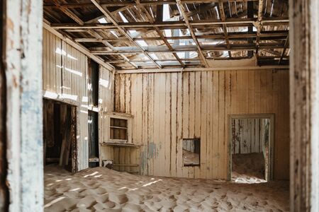 desert sand has invaded and taken over these rooms in Kolmanskoppe, Namibiaの写真素材