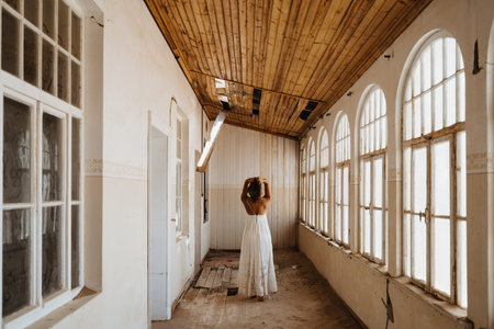 bride after getting ready standing in an abandoned old buildingの写真素材