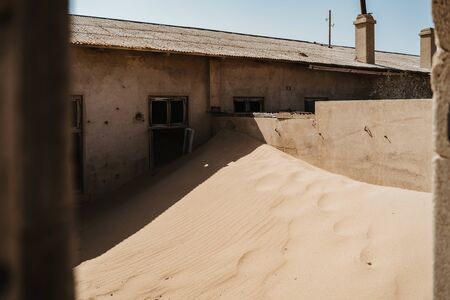 Sand has invaded and taken over this houseの写真素材