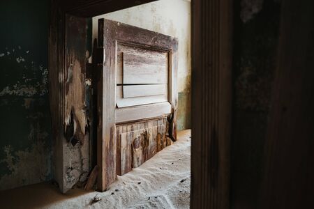 home ruins in the African desert sunk in sandの写真素材