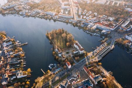 wideangle aerial sunset drone photo of the old city Kopenick Berlin, Germany with the Schlossinsel where the rivers Dahme and Spree connectの写真素材