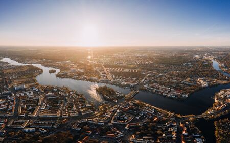 wideangle aerial sunset drone photo of the old city Kopenick Berlin, Germany where the rivers Dahme and Spree connectの写真素材