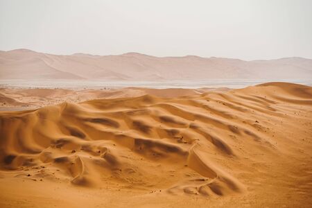 panoramic photo of beautiful red sand dunes at Sossusvlei in Namib Desertの写真素材