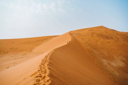 Walking on the sand dunes, Namibia, Africaの写真素材