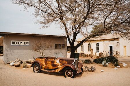 Old Timer Car Wrecks rusty and abandoned in a Desert Landscape in Solitaire, Namibiaの写真素材