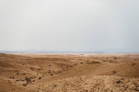 dead moon Landscape with orange rocks, stones and mountainsの写真素材