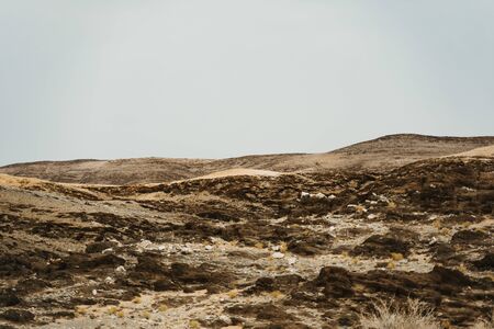 dead Moon Landscape with rocks, stones and mountainsの写真素材