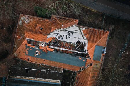 roof of house damaged by heavy hurricane tornado stormの写真素材