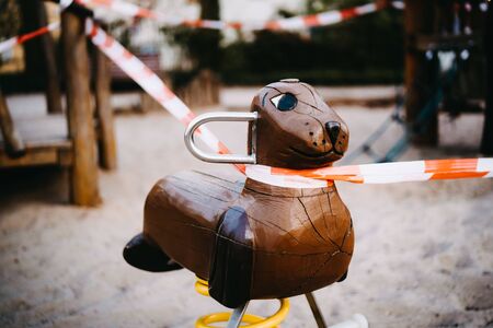 a closed playground where children are not allowed to play anymoreの写真素材