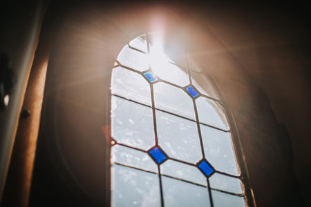 Ray of sunlight shining through window of church