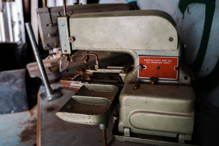 Closeup photo of old sewing machine and item of clothing, vintage retro styleの写真素材