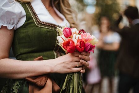Flower bouquet of colorful tulips and wedding dressの写真素材
