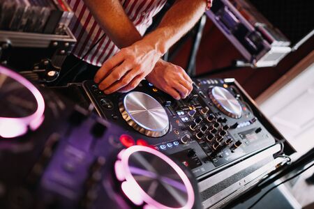 photo of a dj mixer in a live playの写真素材