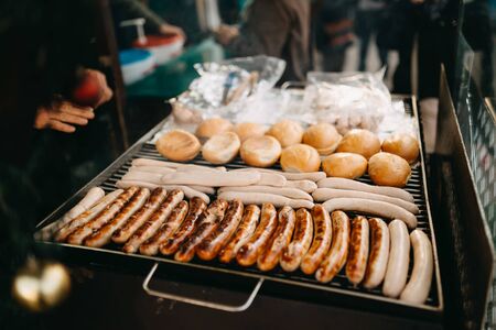 photo of hotdog and bread grilling outdoorの写真素材