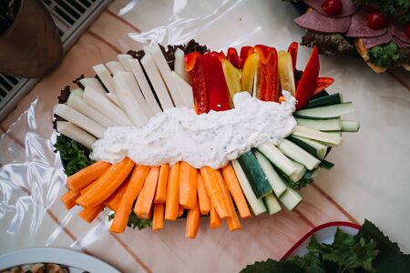 photo of sticks of cucumber and carrots in a plateの写真素材