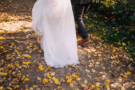 a married couples feet walkingの写真素材