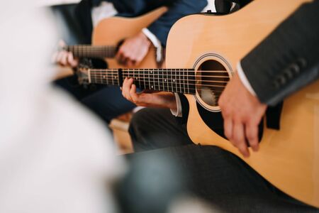 a man playing on the guitarの写真素材