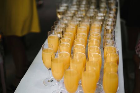 wine and juice glasses on a tableの写真素材