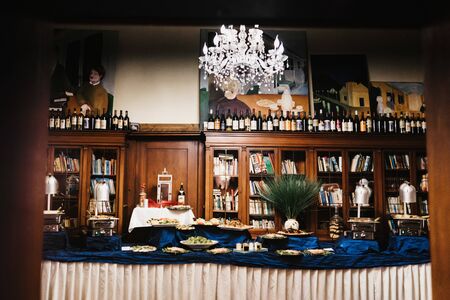 an open buffet in an old house libraryの写真素材