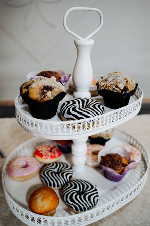 cup cakes and donuts on a tableの写真素材