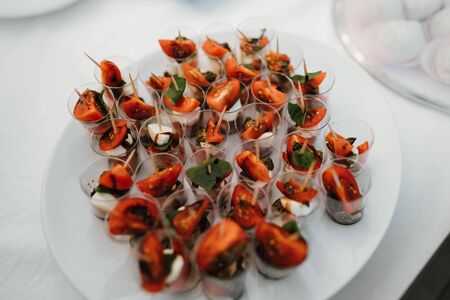 mozzarella finger food sticks in a plateの写真素材