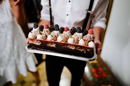 a broom holding a wedding ice cakeの写真素材
