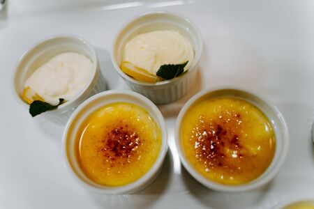 creme brulee small bowls on a tableの写真素材