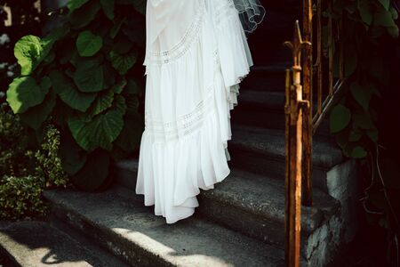 a bride going up on stairsの写真素材