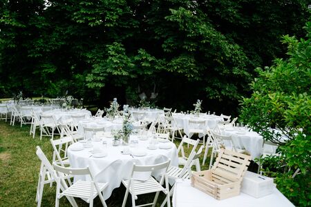an empty wedding dinner tables in the gardenの写真素材