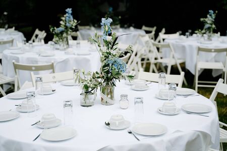 an empty wedding dinner tables in the gardenの写真素材