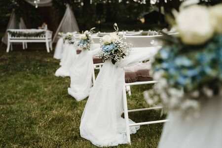 an empty wedding chairs in the gardenの写真素材