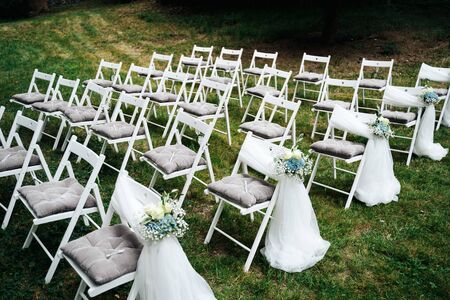 an empty wedding chairs in the gardenの写真素材