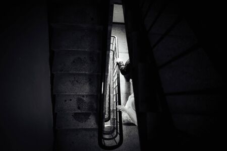 a married couple going down stairsの写真素材