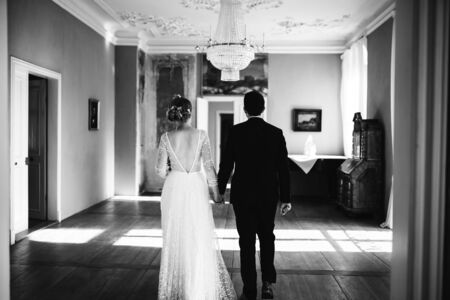 a bride and a groom walking in the houseの写真素材